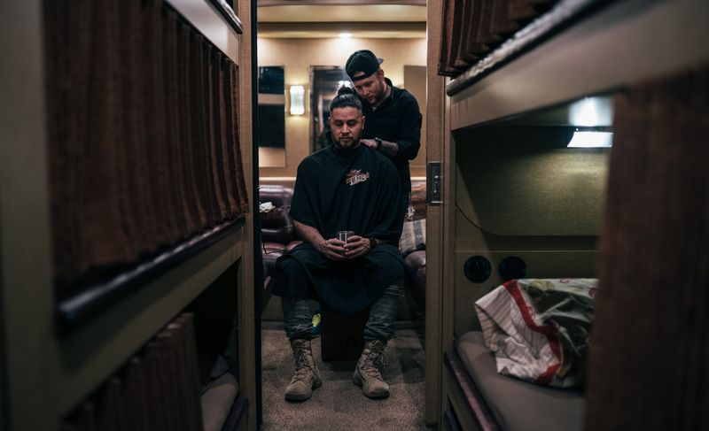 Haircut at the end of a bunk corridor, centered